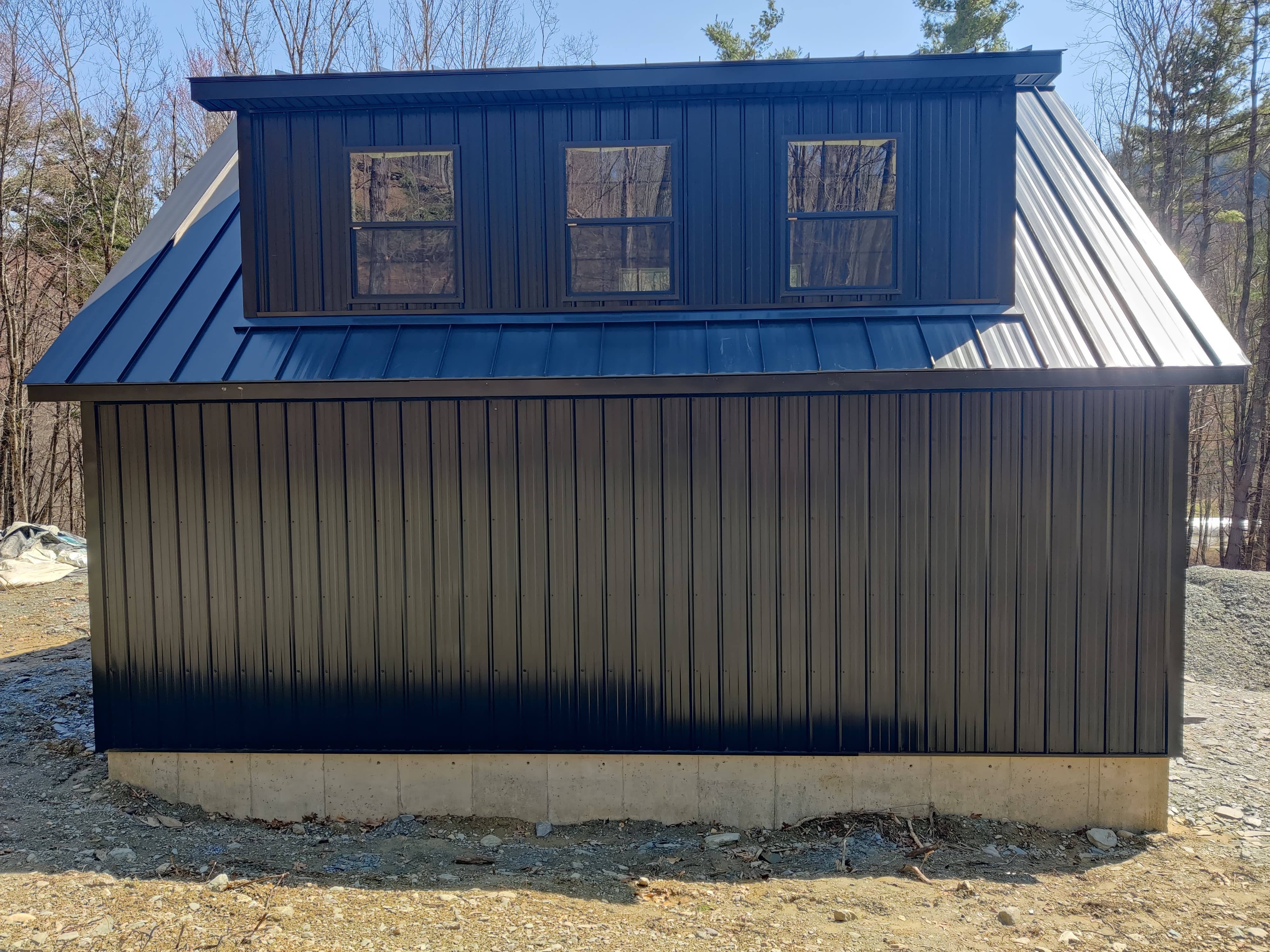 Matte Black Snap Lock Standing Seam with Striations roof on a two-car garage in Albany, NY